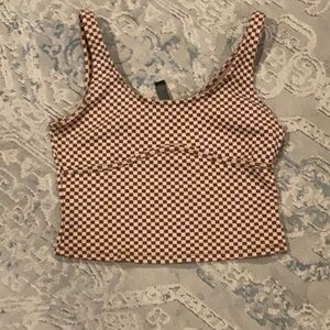 Brown sleeveless crop tank top with scoop neck and fitted style